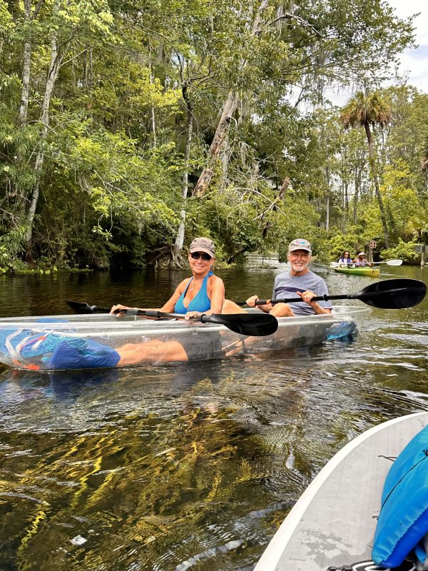 a group of people in a pool of water