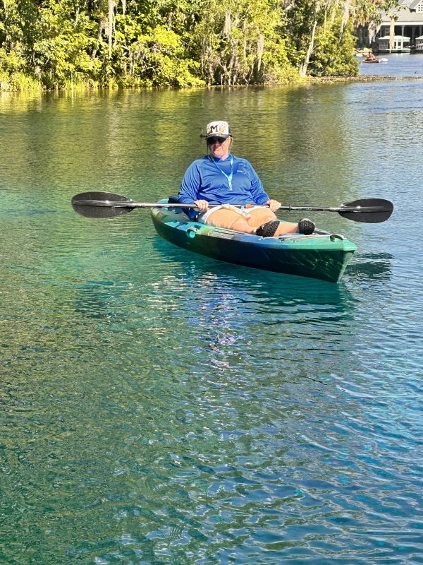 a person rowing a boat in the water