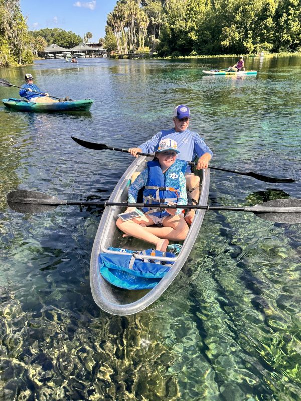 a man rowing a boat in a body of water